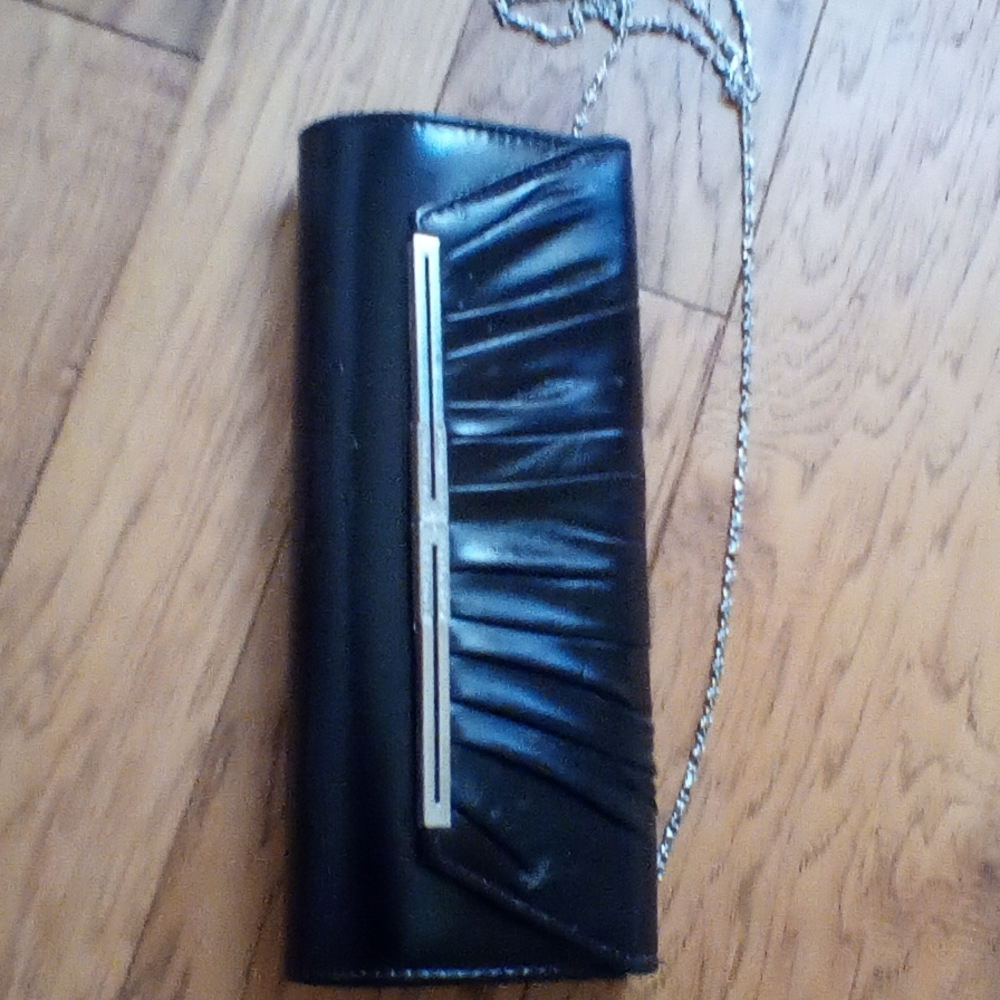 Ladies black  patent clutch bag .